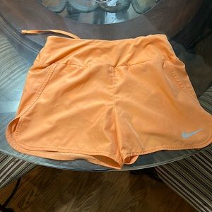 Orange Nike dri-fit shorts